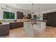 The kitchen showcases a stone island, stainless steel appliances, and stylish lighting at 159 Sims Rd, Tyrone, GA 30290