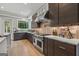 The kitchen features stainless steel appliances, modern backsplash, and lots of cabinet space at 159 Sims Rd, Tyrone, GA 30290