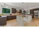 Modern kitchen features a stunning marble island, stainless steel appliances and stylish cabinetry at 159 Sims Rd, Tyrone, GA 30290