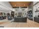 Spacious living room boasts a wood ceiling, modern fireplace, and large windows for abundant natural light at 159 Sims Rd, Tyrone, GA 30290