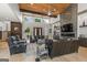 Elegant living room with wooden accents, fireplace, and expansive windows offering scenic views at 159 Sims Rd, Tyrone, GA 30290