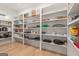 Walk-in pantry with floor to ceiling custom shelves, ideal for storing all of your kitchen essentials at 159 Sims Rd, Tyrone, GA 30290