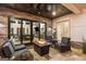 Covered patio with stone surround, ceiling fan, recessed lighting, and cozy seating at 159 Sims Rd, Tyrone, GA 30290
