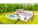 Stunning backyard with a modern pool, outdoor kitchen, and lush lawn at 159 Sims Rd, Tyrone, GA 30290