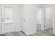 Bright hallway with a door to the outside and wood-look flooring at 435 Prescott Way, Villa Rica, GA 30180
