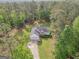 Aerial view showcases a well-maintained property nestled among mature trees, offering a serene and private setting at 2180 Briarwood Ct, Villa Rica, GA 30180