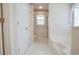 A bathroom with a walk in shower, a soaking tub, and decorative wallpaper at 2180 Briarwood Ct, Villa Rica, GA 30180