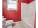 Bathroom with white shower-tub combo, neutral floor, and window at 2180 Briarwood Ct, Villa Rica, GA 30180