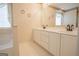 Bathroom features a dual sink vanity and framed mirror at 2180 Briarwood Ct, Villa Rica, GA 30180
