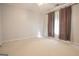 This bedroom features neutral walls, carpet, and curtains at 2180 Briarwood Ct, Villa Rica, GA 30180