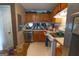 Kitchen with oak cabinets, laminate countertops and stainless steel dishwasher at 3191 Kingswood Gln, Decatur, GA 30034