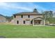 New construction home with a sprawling, grassy backyard and covered porch at 100 Bre Dr, Fayetteville, GA 30214