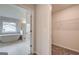 View into bathroom with soaking tub and closet with wire shelves at 100 Bre Dr, Fayetteville, GA 30214