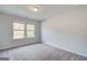 This is a large bedroom with gray carpet and two windows for natural light at 100 Bre Dr, Fayetteville, GA 30214