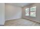 Cozy bedroom with bright windows, modern flooring, a fresh coat of paint, and a serene atmosphere at 100 Bre Dr, Fayetteville, GA 30214