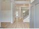 Welcoming foyer featuring light wood floors, wainscoting, and stairs with iron balusters and a complementary color scheme at 100 Bre Dr, Fayetteville, GA 30214