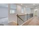 This is an open hallway with metal and wood railings and views of the rooms nearby at 100 Bre Dr, Fayetteville, GA 30214
