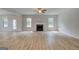 Bright living space features sleek floors, fireplace, and abundant natural light at 100 Bre Dr, Fayetteville, GA 30214