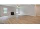 Bright living space features sleek floors, a fireplace, and abundant natural light at 100 Bre Dr, Fayetteville, GA 30214