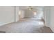 Large main bedroom with ceiling fan, connecting hallway, gray carpet and natural light at 100 Bre Dr, Fayetteville, GA 30214