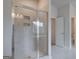 Modern bathroom featuring a glass enclosed shower and neutral tile at 100 Bre Dr, Fayetteville, GA 30214