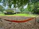 Enjoy the outdoors with a hammock in your yard in a quiet backyard setting at 508 Caxton Ct, Peachtree City, GA 30269
