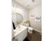 Cozy half-bath with updated vanity, round mirror, and modern decor at 508 Caxton Ct, Peachtree City, GA 30269