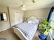 Carpeted bedroom featuring a window, closet, and ceiling fan at 508 Caxton Ct, Peachtree City, GA 30269