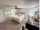 Bright bedroom with a ceiling fan, neutral decor, and carpet flooring at 508 Caxton Ct, Peachtree City, GA 30269