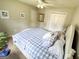 Bedroom featuring carpet, closet, bed, ceiling fan, and natural light at 508 Caxton Ct, Peachtree City, GA 30269
