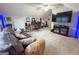 Large bonus room with desk, couch, and entertainment center is the perfect place to relax or work at 508 Caxton Ct, Peachtree City, GA 30269