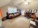 Spacious bonus room features a comfortable seating area, study area, and neutral carpeting at 508 Caxton Ct, Peachtree City, GA 30269