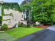 Exterior view features lush landscaping, private driveway, and well-maintained lawn at 508 Caxton Ct, Peachtree City, GA 30269