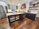 Bright, modern kitchen featuring custom cabinets and an island offering barstool seating and storage at 508 Caxton Ct, Peachtree City, GA 30269