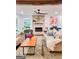Inviting living room featuring a stone fireplace, hardwood floors, and comfortable seating, perfect for relaxation at 508 Caxton Ct, Peachtree City, GA 30269