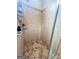 Enclosed tile shower featuring stone flooring and a tiled shower head at 508 Caxton Ct, Peachtree City, GA 30269