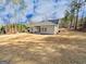 Expansive backyard with a view of the home's exterior and surrounding landscape at 5096 Cumberland Ct # 96, Villa Rica, GA 30180