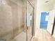 Bathroom featuring a glass door shower, hardwood floors and views to the bedroom at 5096 Cumberland Ct # 96, Villa Rica, GA 30180