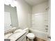 Clean bathroom with a granite vanity, white cabinets, and a shower-tub combination at 5096 Cumberland Ct # 96, Villa Rica, GA 30180