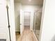 Modern bath offers a glass shower enclosure, a neutral color scheme, and easy access to the walk-in closet at 5096 Cumberland Ct # 96, Villa Rica, GA 30180