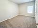 Neutral bedroom with a carpet, a window bringing in natural light, and a closet at 5096 Cumberland Ct # 96, Villa Rica, GA 30180
