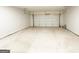 Spacious two-car garage with high ceilings and ample room for storage or projects at 5096 Cumberland Ct # 96, Villa Rica, GA 30180