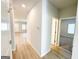 Bright hallway with wood-look flooring, connecting various rooms within the home at 5096 Cumberland Ct # 96, Villa Rica, GA 30180