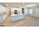 Open kitchen with white cabinets, granite counters, island, and stainless steel appliances at 5096 Cumberland Ct # 96, Villa Rica, GA 30180