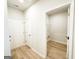 Convenient mud room entry featuring wood flooring and access to a laundry room at 5096 Cumberland Ct # 96, Villa Rica, GA 30180