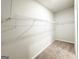 This is a carpeted walk-in closet with shelving for optimal organization at 5096 Cumberland Ct # 96, Villa Rica, GA 30180