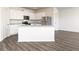 Modern kitchen with white cabinets, stainless steel appliances, and a center island at 260 Oliver Dr, Locust Grove, GA 30248