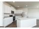 Modern kitchen featuring white cabinets, stainless steel appliances, and granite countertops at 260 Oliver Dr, Locust Grove, GA 30248