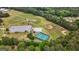 Aerial view of multiple sports fields, including baseball, soccer, and a tennis court, with ample parking at 150 Rockspray Rdg, Peachtree City, GA 30269