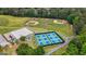 Aerial view showcasing tennis courts, basketball courts, baseball fields, and playground for community recreational activities at 150 Rockspray Rdg, Peachtree City, GA 30269